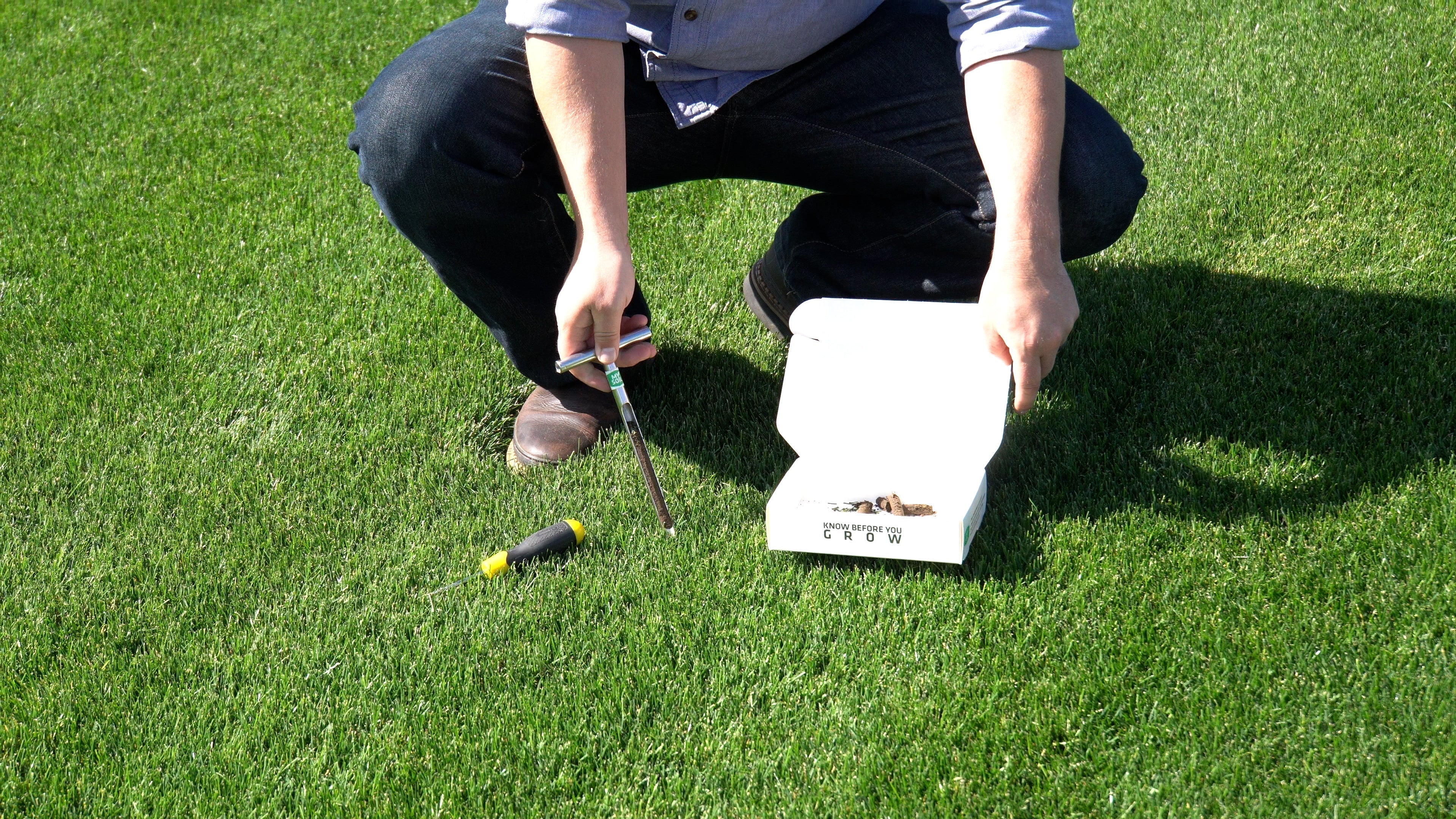 Using a soil probe to get a soil core for a MySoil soil test kit