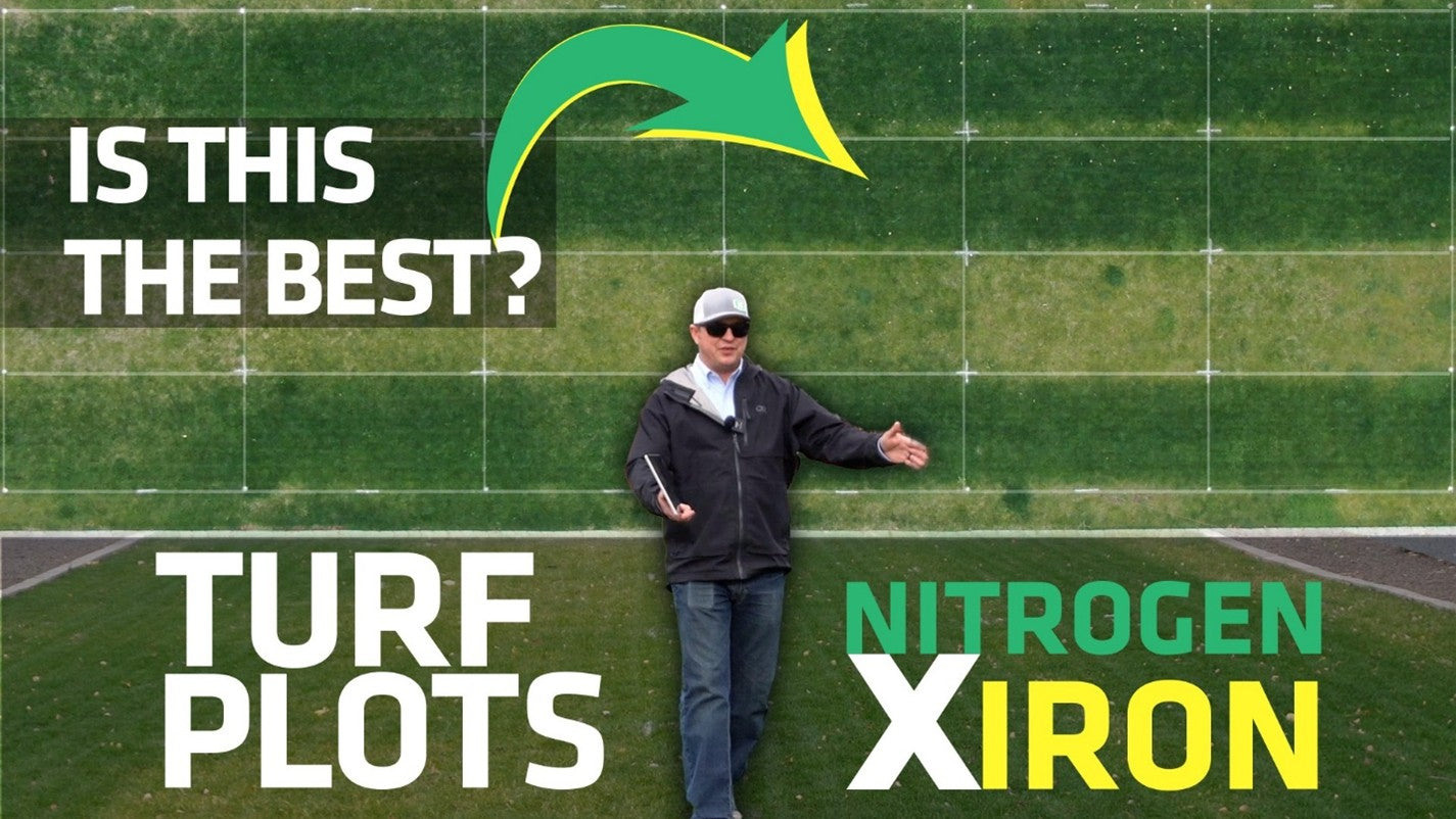 Matt in front of aerial image of nitrogen by iron demonstration plots